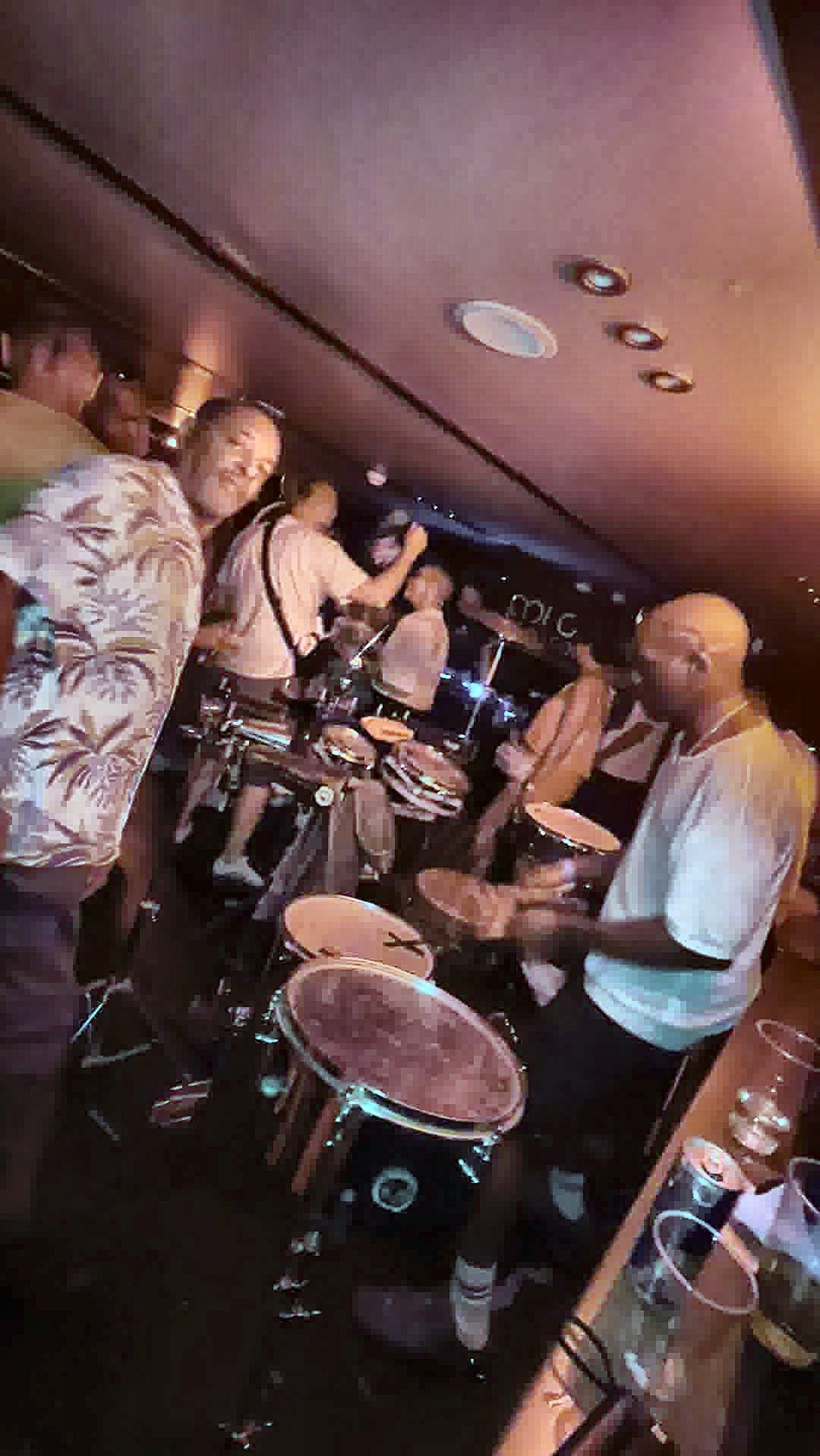 Wayne of BongoFlex performing percussion to a dancing crowd
